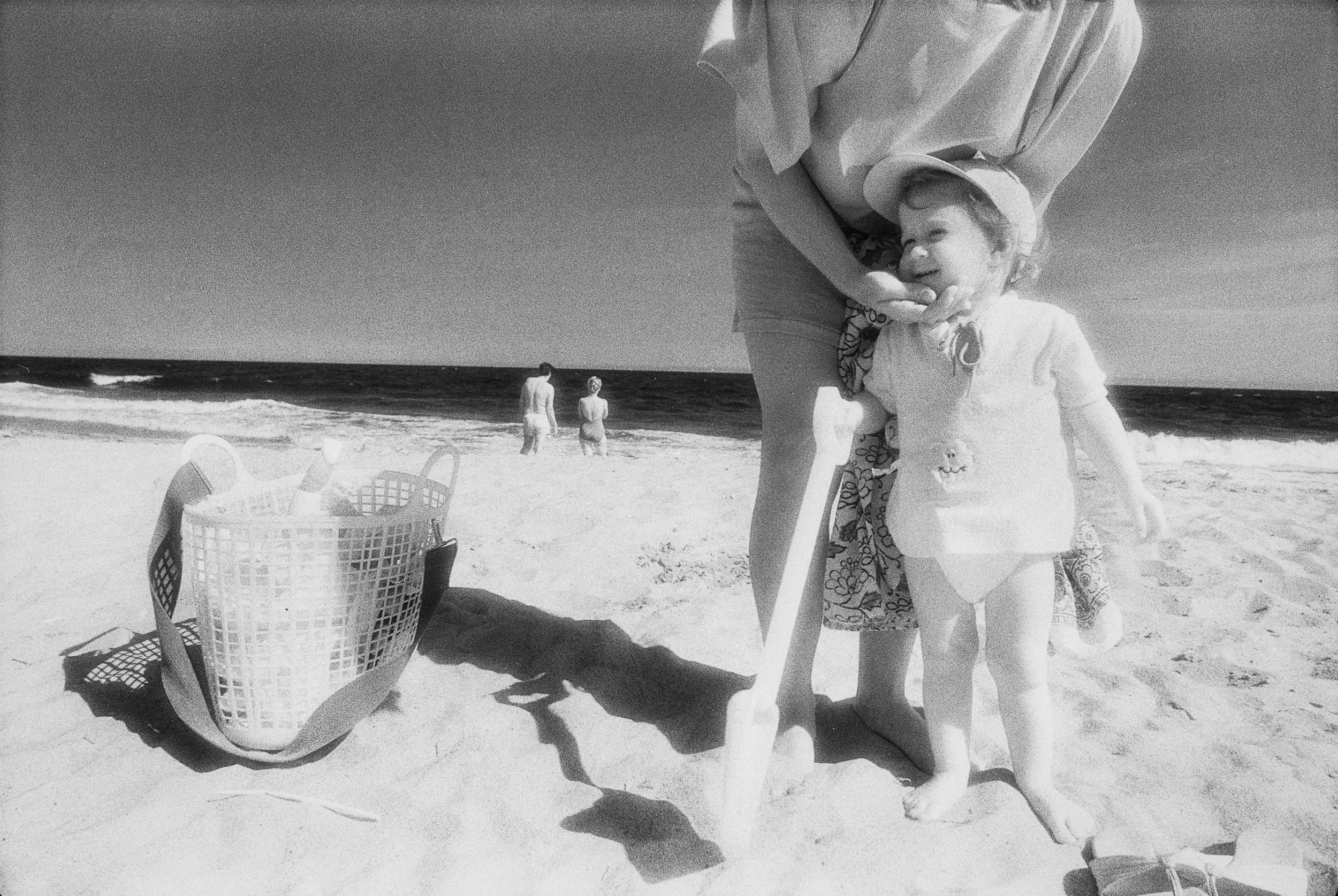 Barbara Alper- Photo of little boy with a shovel on Rockaway Beach NYC