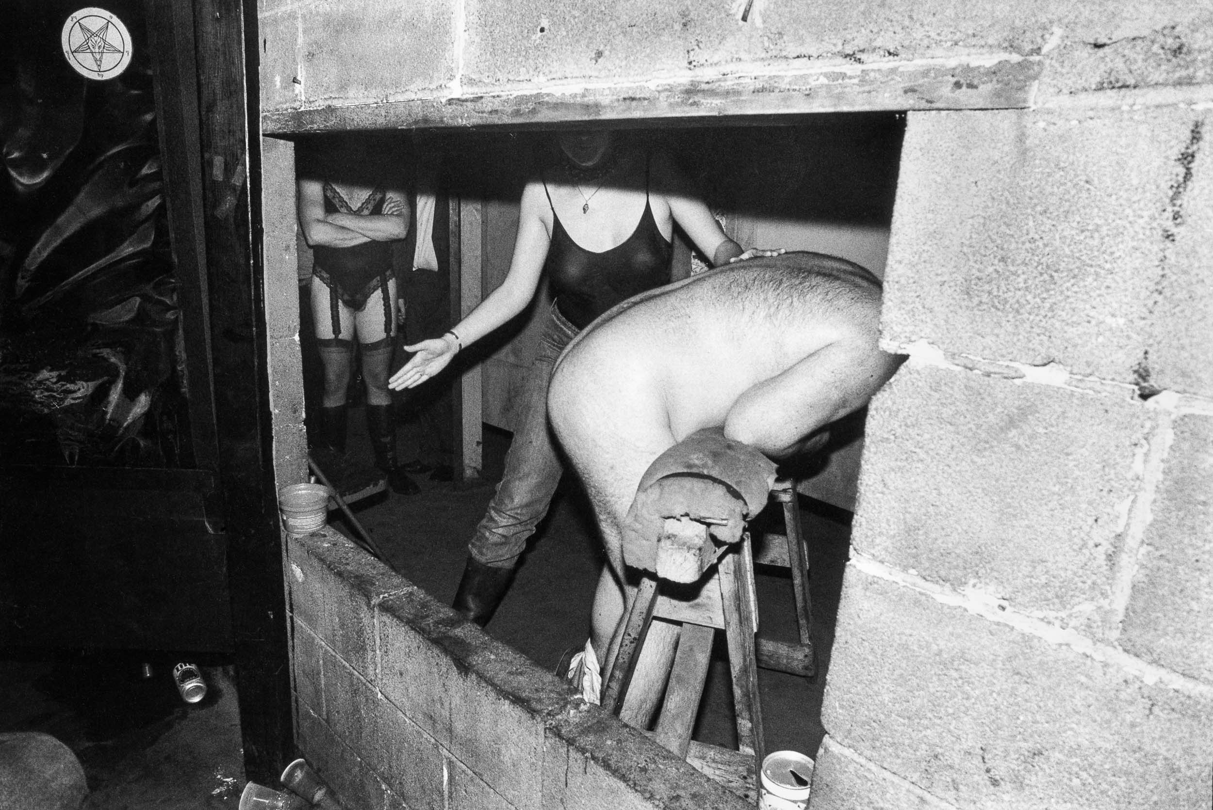 Barbara Alper- BDSM photo of a man being spanked at the Hellfire Club, NYC