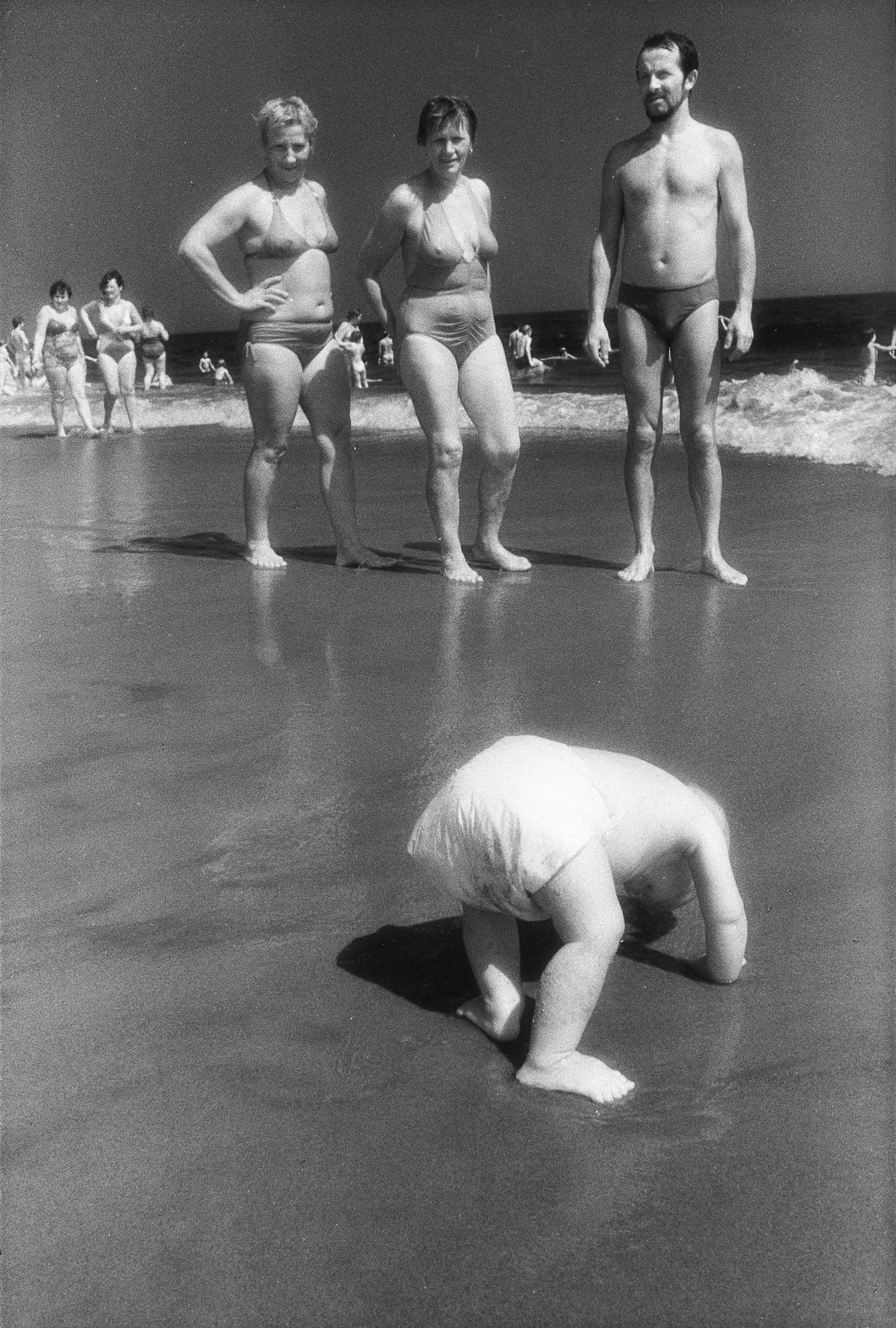 Barbara Alper- photo of baby with her butt in the air on Rockaway Beach NYC
